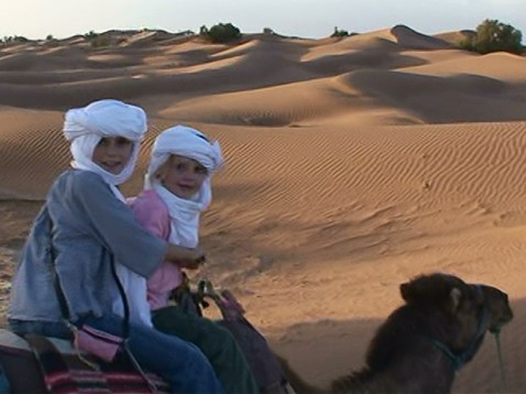 Unexpected Morocco » girls-in-desert-on-camels